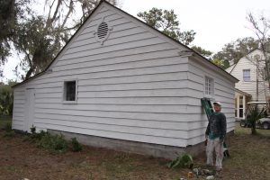 Jean Spencer painting the garage. Jean is a historic preservationist and a house painter by trade in Atlanta. 